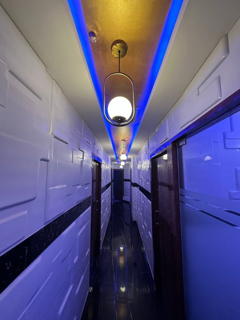 Modern spa room at Sunshine Wellness Spawith soft lighting and comfortable massage tables